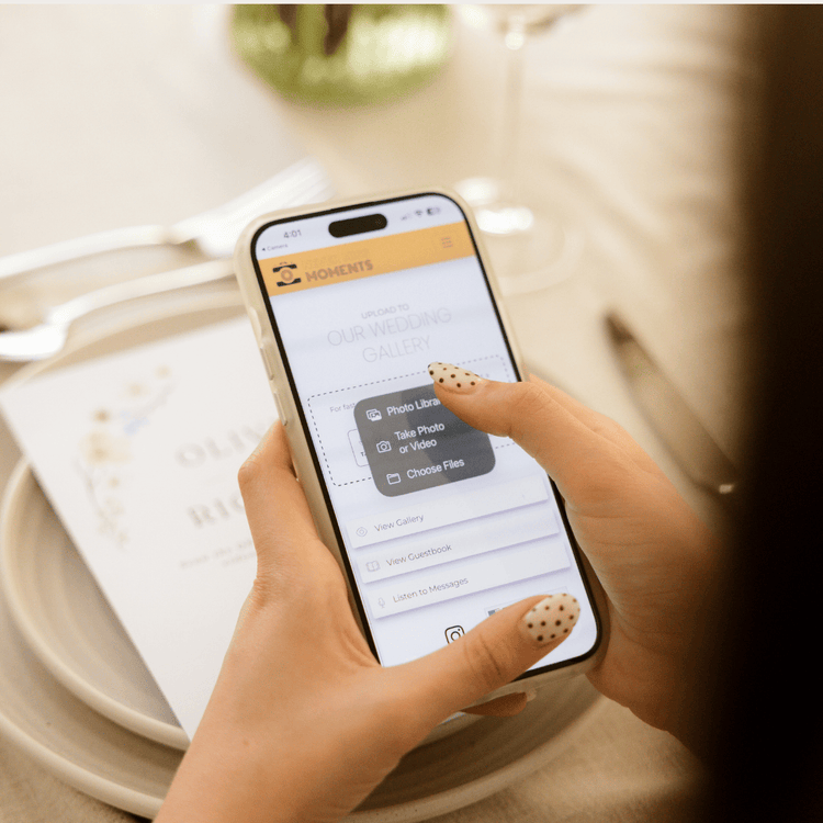 Guests scanning QR code to upload wedding photos